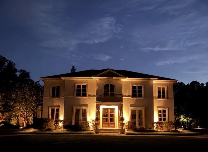Estate grounds after, lit at dusk